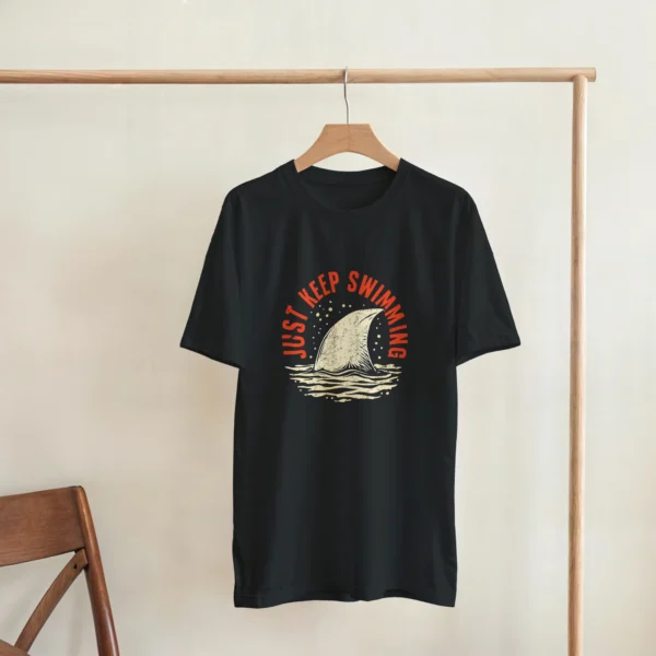Keep Swimming Shark Fin Tee , Heavyweight Unisex Crewneck T-shirt in Dark Heather or Black